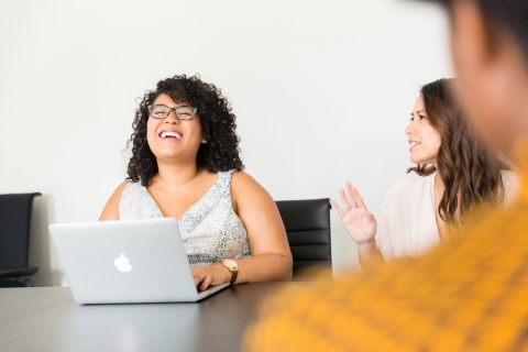 Woman laughing with her team