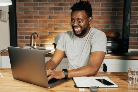 Man working on laptop at home